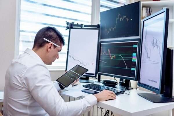 Solana trading charts on multiple screens