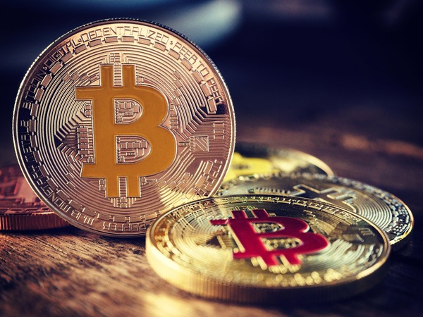 Gold cryptocurrency coins representing exchange transaction flow